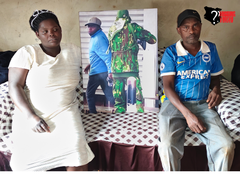 Susan Njeri and Husband Pose with photo of Slain Son.Photo/MV.